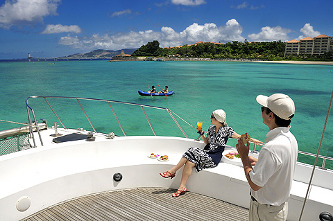 a couple on the boat enjoying drinks and snacks