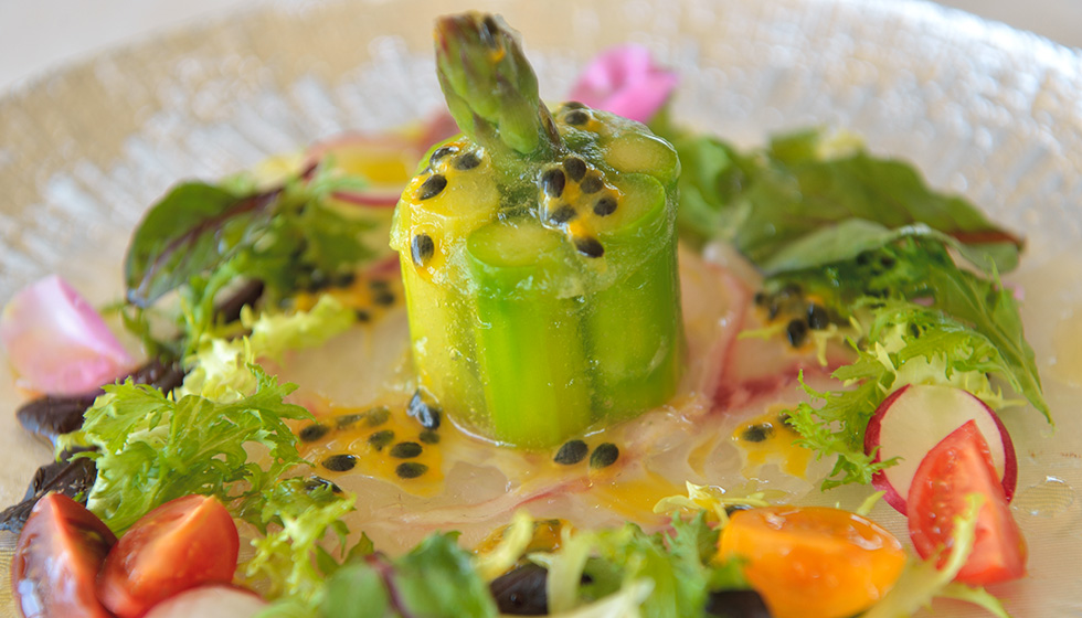marinated asparagus and local white fish with sweet and sour peach and passion fruit sauce